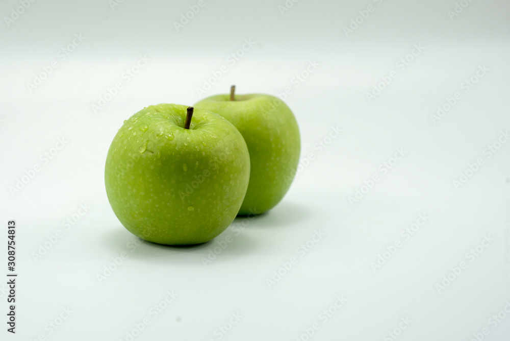 Fresh green apples on a white background isolated. Fresh green apples on a white background isolated.