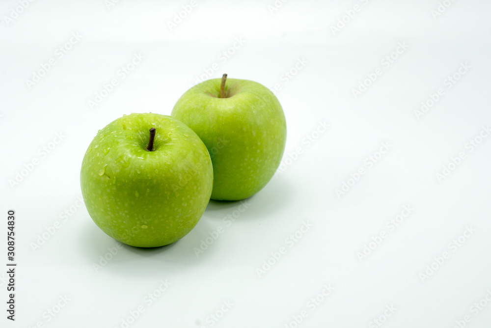 Fresh green apples on a white background isolated. Fresh green apples on a white background isolated.