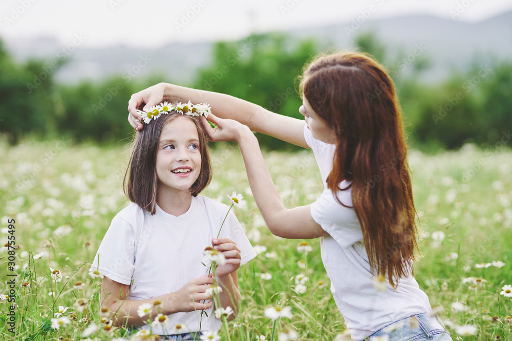Fototapeta premium mother and daughter having fun in the park