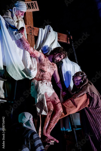 Christ is descended from the cross by Joseph of Arimathea and Nicodemus photo