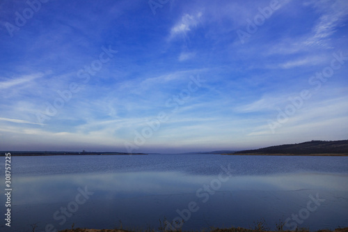 sunset sky blue and pink over a lake in Gagauzia