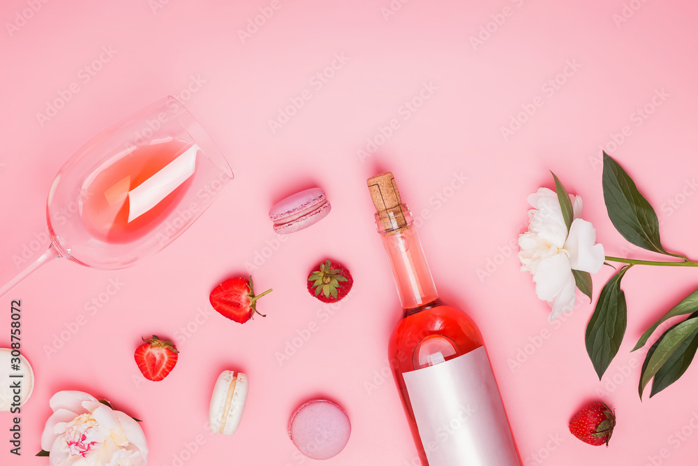Summer flat lay with rose wine, delicious strawberries and beautiful peonies Summer flat lay with rose wine, delicious strawberries and beautiful peonies