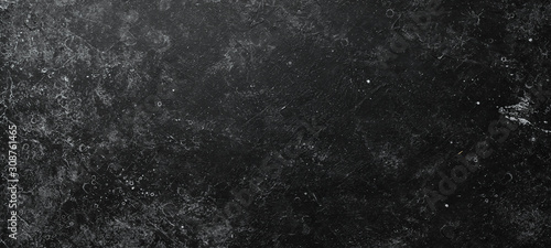 Black stone background. Stone texture. Top view. Free space for your text.