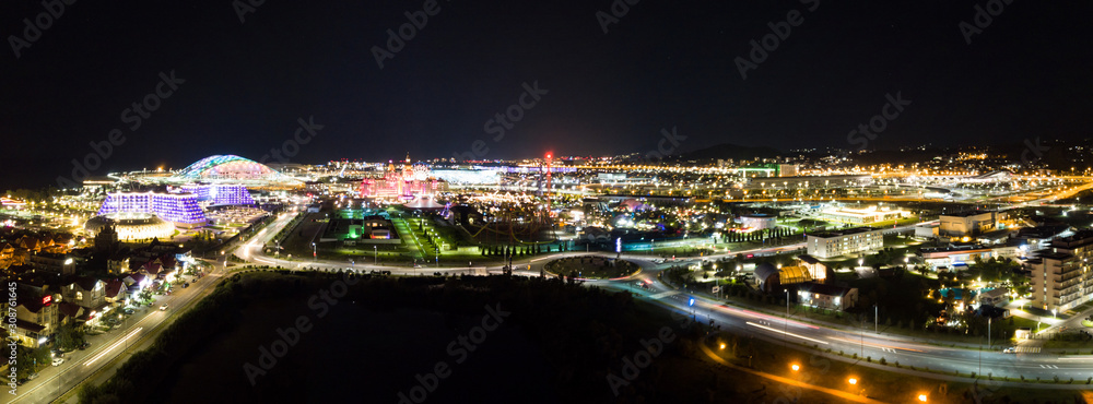 Aerial panoramic view of illuminated Olympic Park at night, Sochi, Russia.