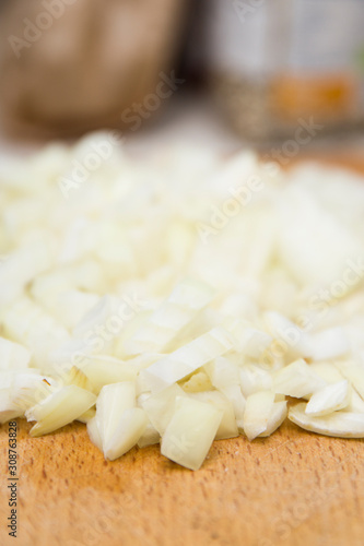 Chopped onions on wooden cu...