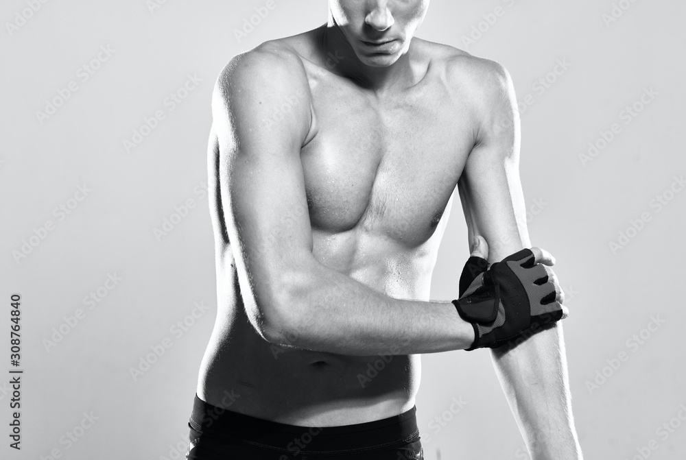 Naklejka premium muscular man with dumbbells