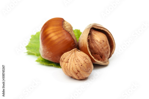 Hazelnut nut many leaves isolated on a white background as a packaging design element