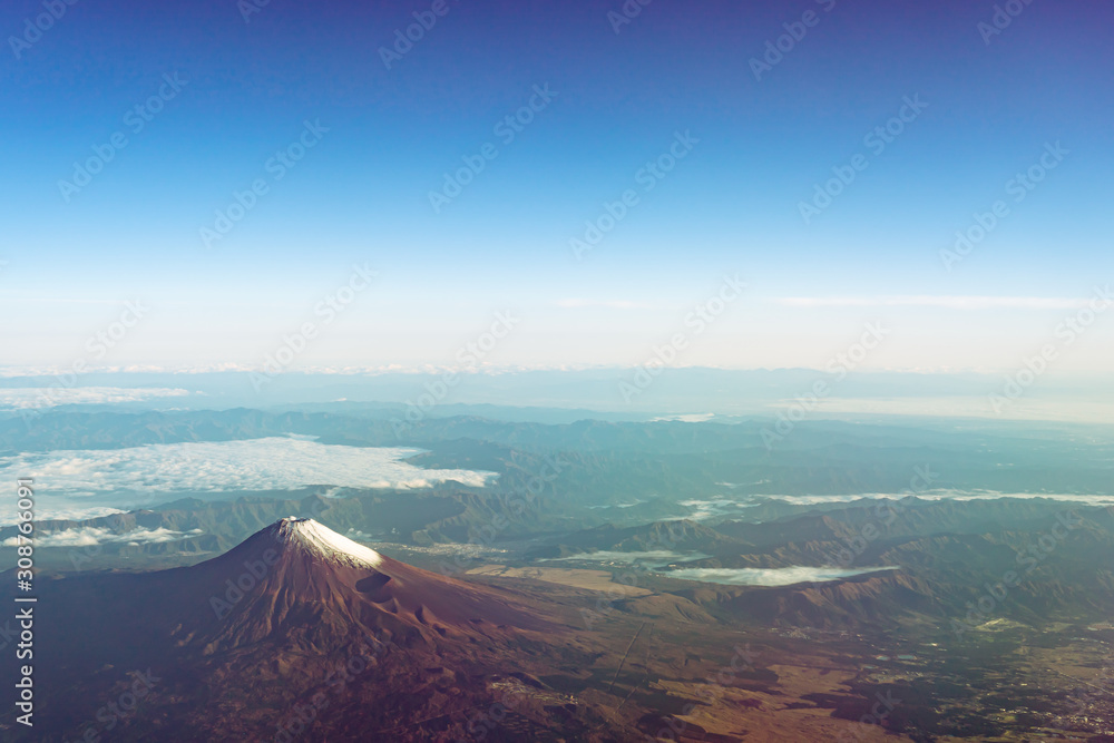 A birds eye view close-up the Mount Fuji ( Mt. Fuji ) and blue sky. Scenery landscapes of the Fuji-Hakone-Izu National Park. Shizuoka Prefecture, Japan A birds eye view close-up the Mount Fuji ( Mt. Fuji ) and blue sky. Scenery landscapes of the Fuji-Hakone-Izu National Park. Shizuoka Prefecture, Japan