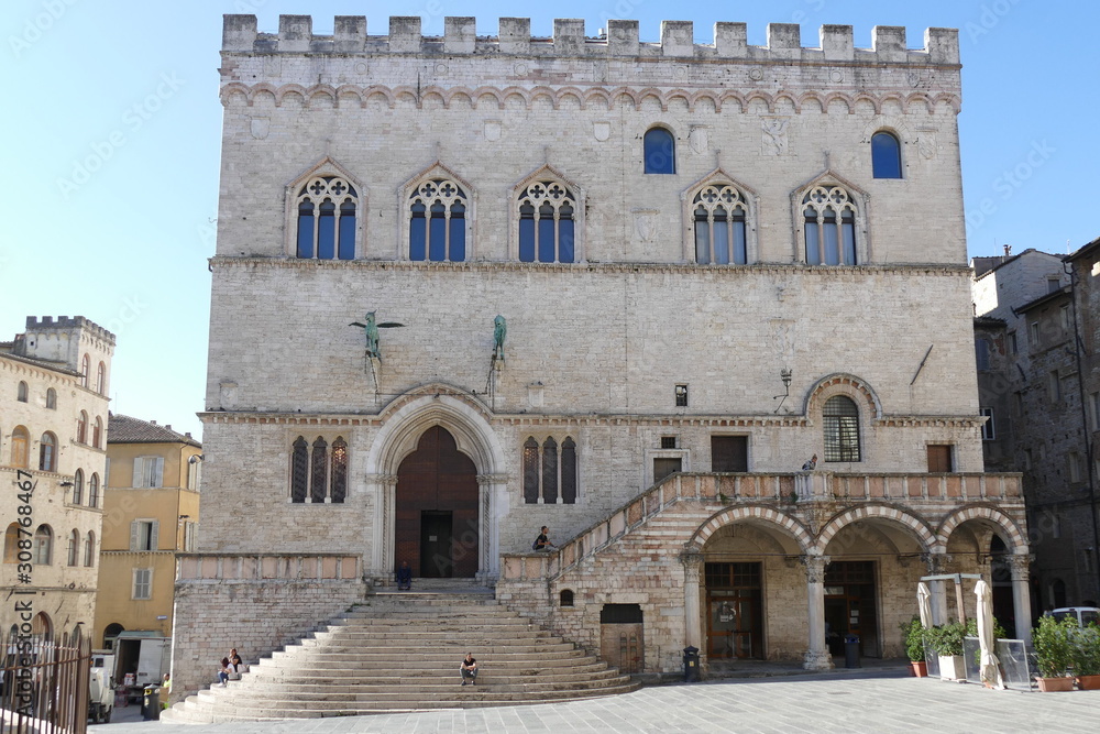 Palazzo dei Priori, Perugia. Palazzo dei Priori is a medieval palace and it has a facade with a stair to a portal with above two bronze statues. It is situated in square Piazza IV Novembre, Perugia, I