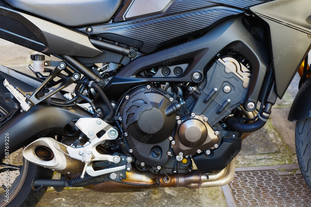 Closeup of motorbike engine on the street Closeup of motorbike engine on the street