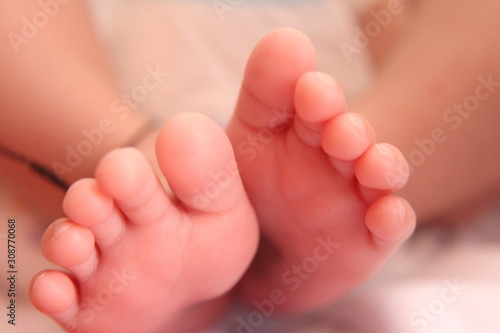 Closeup new born infant baby feet.