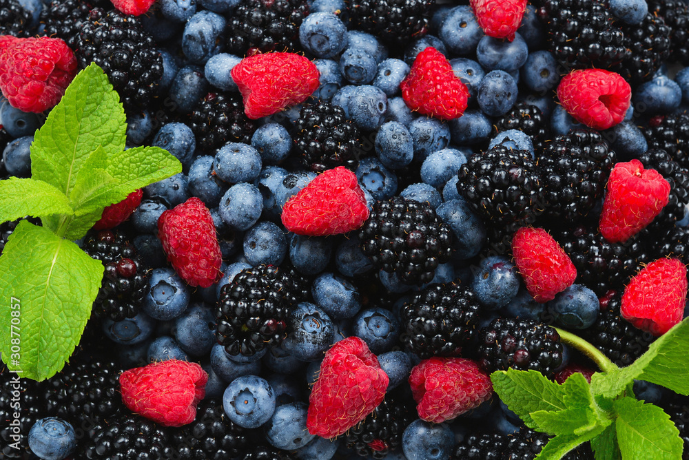 Blackberry, raspberry, blueberry and mint background. Blackberry, raspberry, blueberry and mint background.