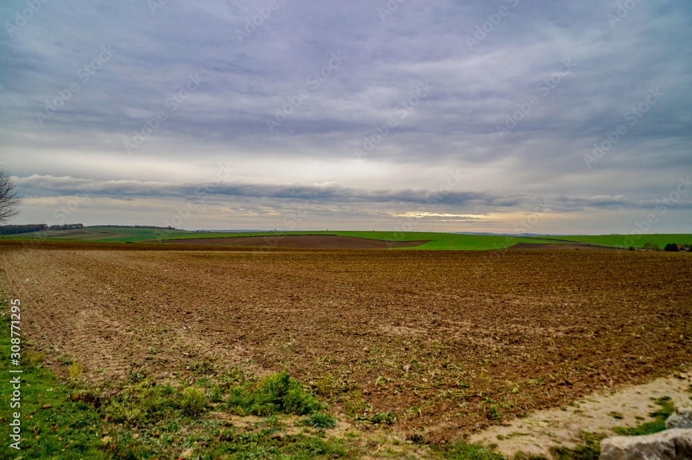 plowed field and blue sky in Northern France plowed field and blue sky in Northern France