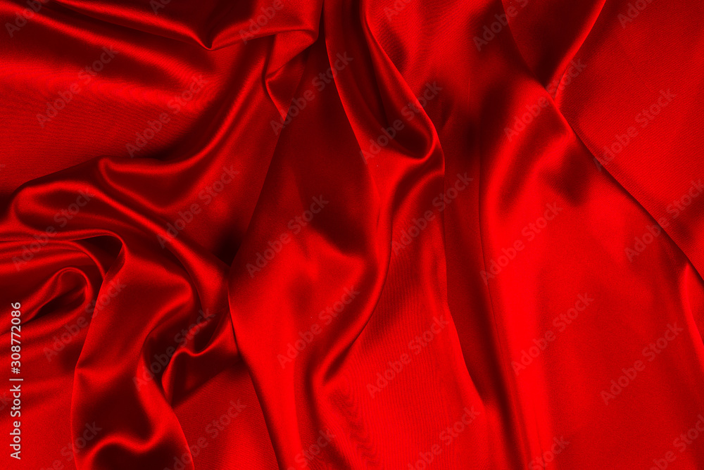 Red silk or satin luxury fabric texture can use as abstract background. Top view. Red silk or satin luxury fabric texture can use as abstract background. Top view.