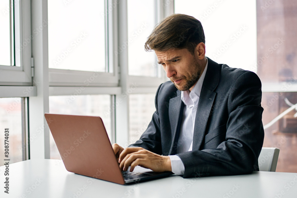businessman working on laptop in office businessman working on laptop in office