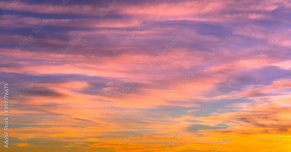sunset sky with beautiful orange and pink and blue colors, background