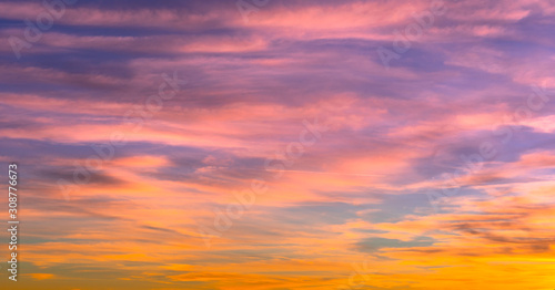 sunset sky with beautiful orange and pink and blue colors, background © Davide Marconcini
