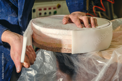 Making upholstered furniture, preparing a seat for a bar stool, applying glue with a spray gun
