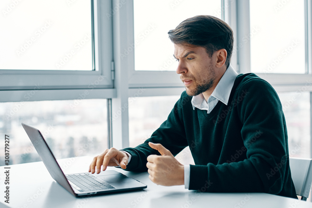 businessman working on laptop in office businessman working on laptop in office