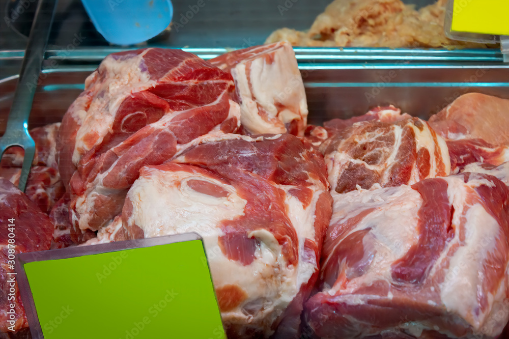 Fresh raw meat pork on a store counter. Pork fillet. Closeup.