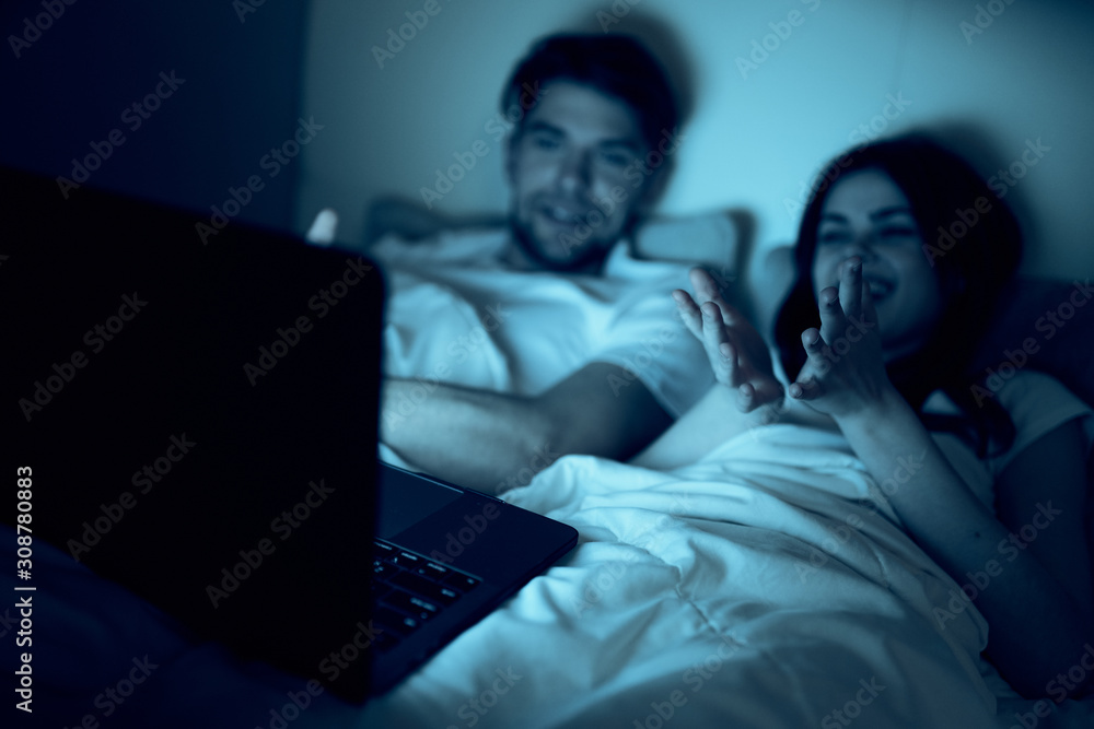 couple watching tv at home
