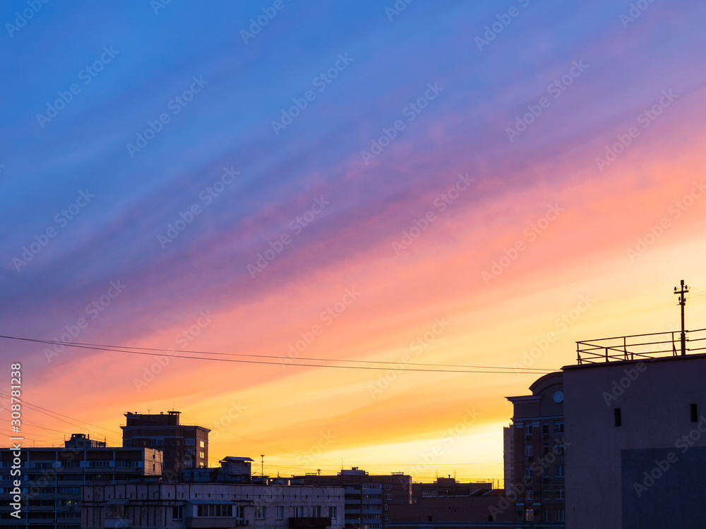 multicolour sunset sky over apartment buildings