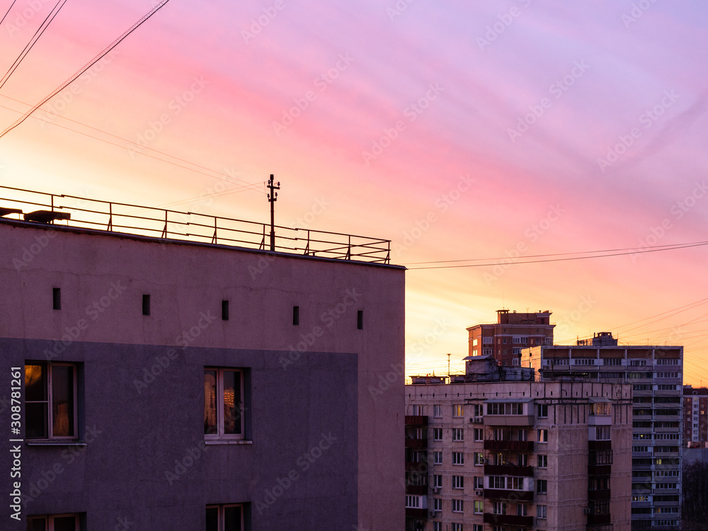 pink sunset sky over apartment houses in Moscow