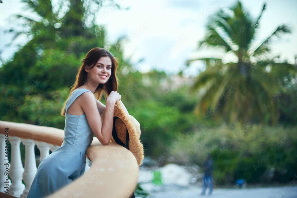 young woman sitting on a bench in the park young woman sitting on a bench in the park