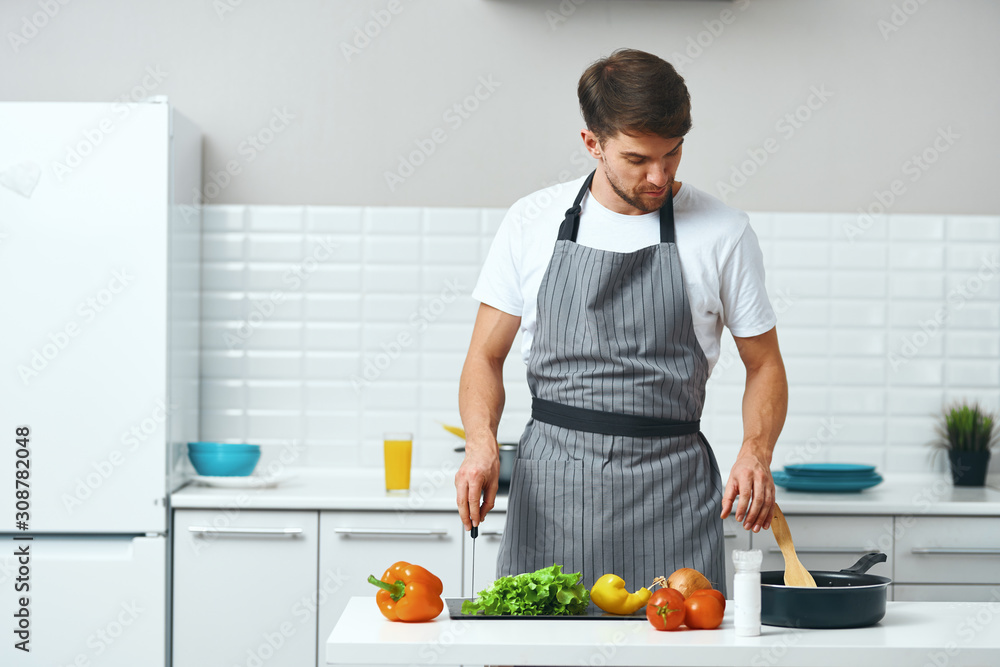 man preparing food in the kitchen man preparing food in the kitchen