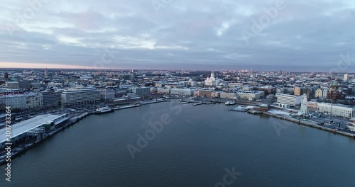 Aerial view Of Helsinki city from the sea. Sunset Evening Illuminations. Scenic winter view of the Old town. Finland. 4K