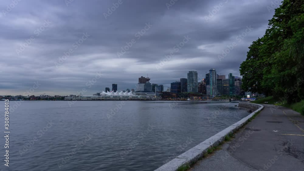 Time Lapse of Beautiful view of Vancouver Downtown during a morning sunrise. Picture taken from Stanley Park in British Columbia, Canada. Time Lapse of Beautiful view of Vancouver Downtown during a morning sunrise. Picture taken from Stanley Park in British Columbia, Canada.