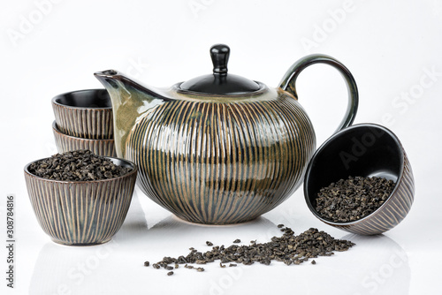 Ceramic teapot and several cups