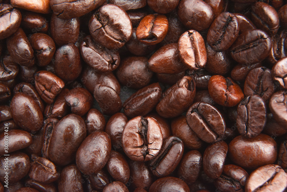 Fototapeta premium Roasted coffee beans texture used as a background / Close up