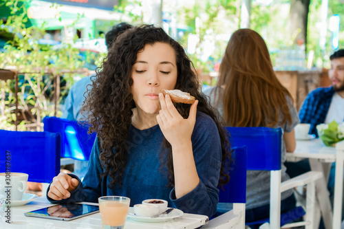 Young woman having breakfast.