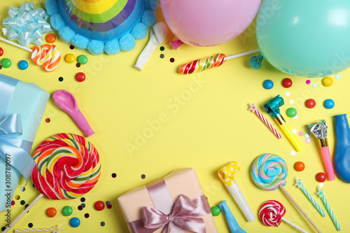 Flatlay composition with accessories for a party or birthday on a colored background with place for text top view.