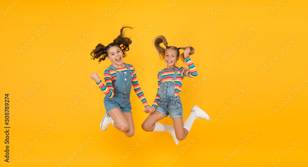 Emotional kids. Fashion shop. Must have accessory. Modern fashion. Kids fashion. Little girls wearing rainbow clothes. Happiness. Girls long hair. Cute children same outfits. Trendy and fancy