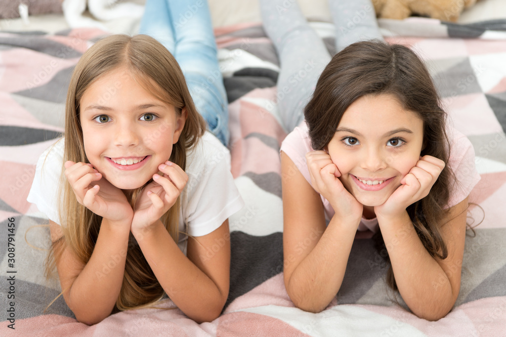 Free your smile. Little girls smile relaxing on bed. Happy children smiling. Dental care. Dentistry for kids. Keeping teeth white and clean. Smile a happy smile Free your smile. Little girls smile relaxing on bed. Happy children smiling. Dental care. Dentistry for kids. Keeping teeth white and clean. Smile a happy smile