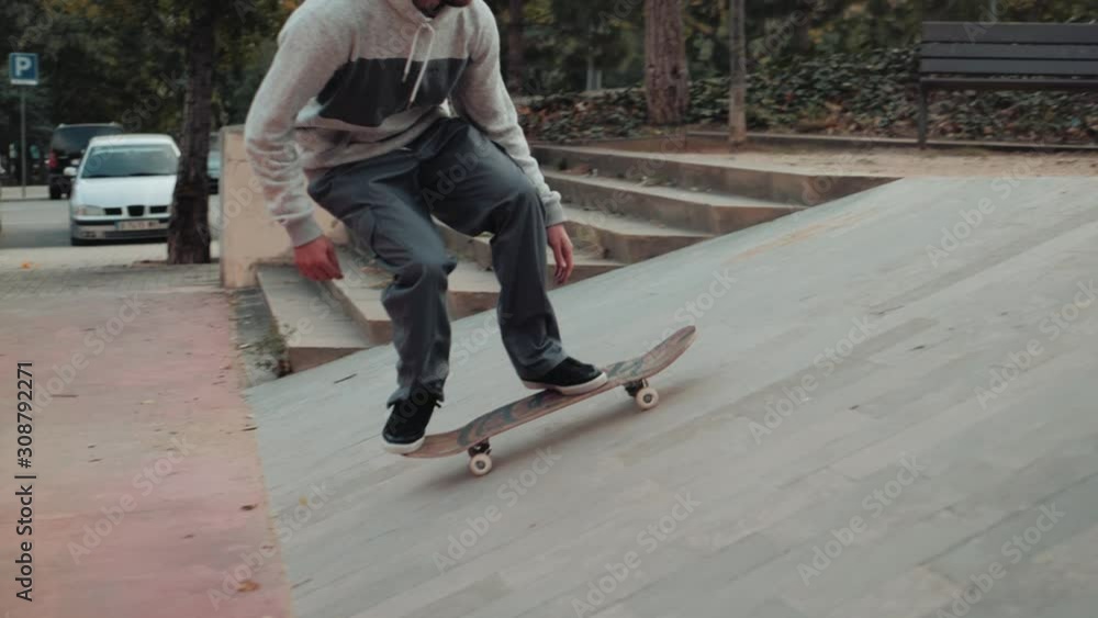 Professional skater jump with kickflip flip trick on board, skateboarder ollie, skateboarding - street extreme sport Professional skater jump with kickflip flip trick on board, skateboarder ollie, skateboarding - street extreme sport