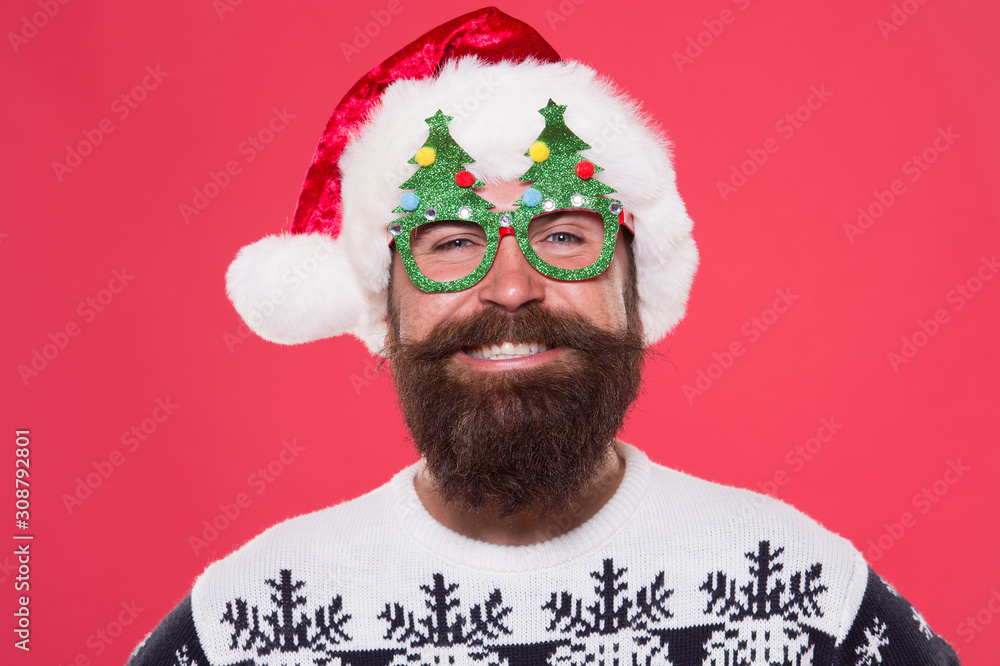 Good mood. Santa is coming. Santa man wear christmas tree party glasses. Happy bearded man with santa look. Holiday accessories for santa party. Christmas and New Year celebration. Emotional face