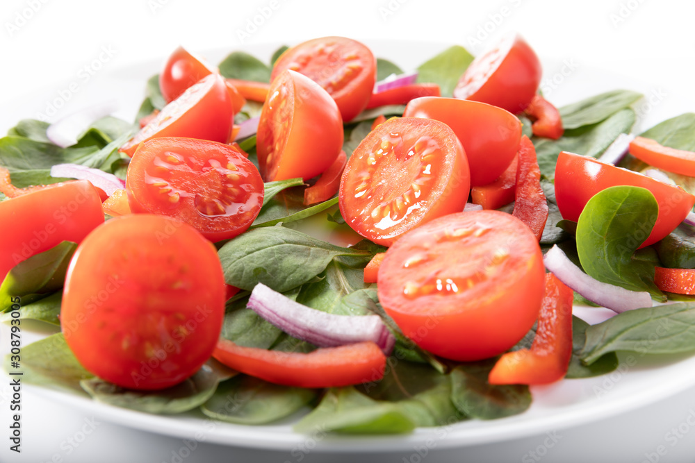 Fresh salad with tomatoes, isolated on white background Fresh salad with tomatoes, isolated on white background