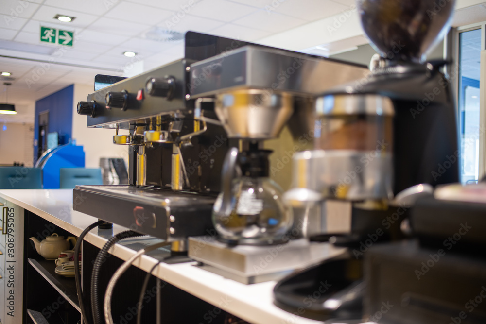 Selective focus on coffee machine on counter Selective focus on coffee machine on counter