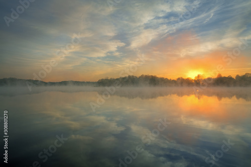 Spring sunrise Whitford Lake in light fog  Fort Custer State Park  Michigan  USA