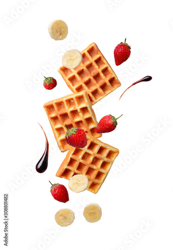 Belgium waffles with strawberries and banana photo