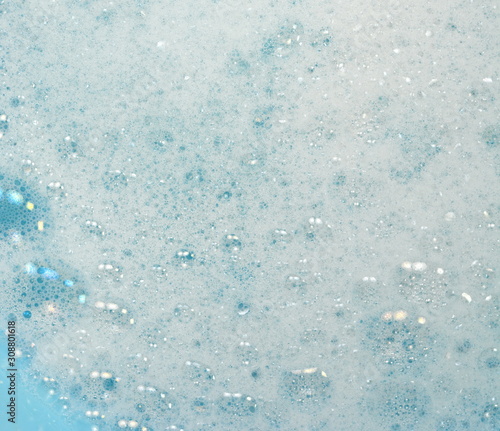 Foam bubble from soap or shampoo washing on top view. Foam background. White foam.
