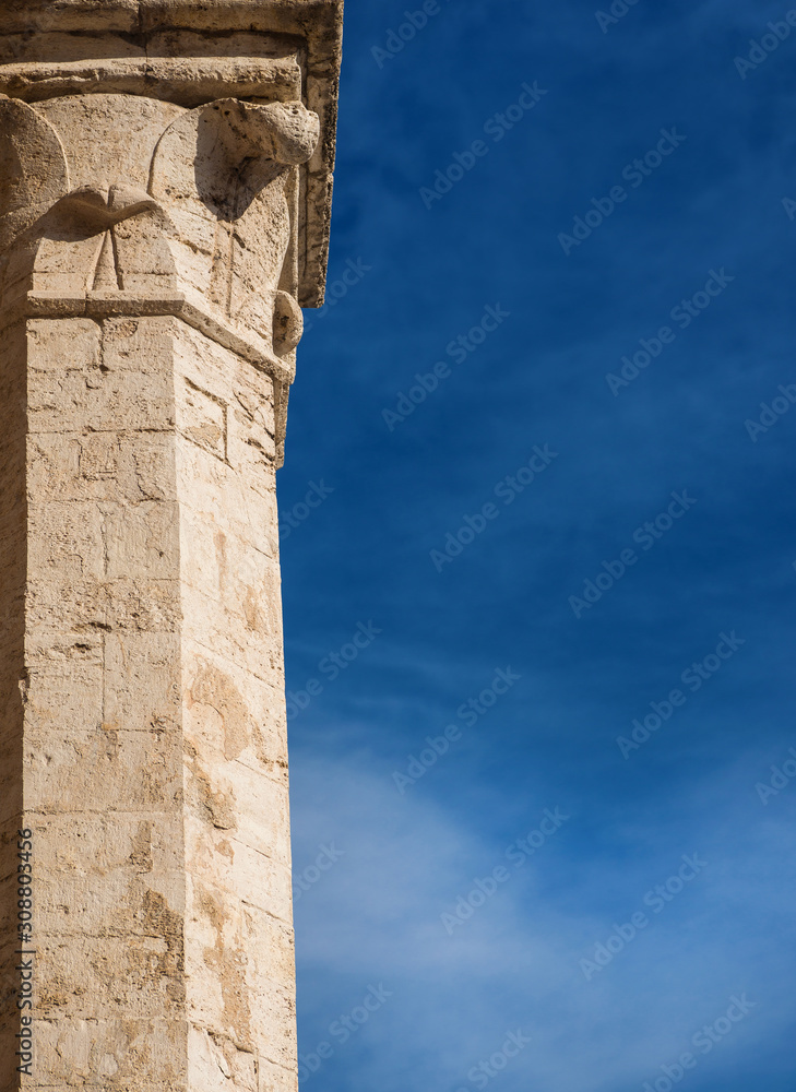 Medieval architecture in Perugia. Ancient marble column with sky and copy space