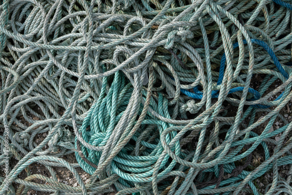 Twisted nylon rope in a tangled mass background Twisted nylon rope in a tangled mass background