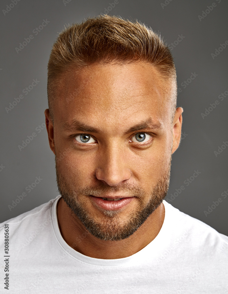 Face of handsome blond man looking at camera Face of handsome blond man looking at camera