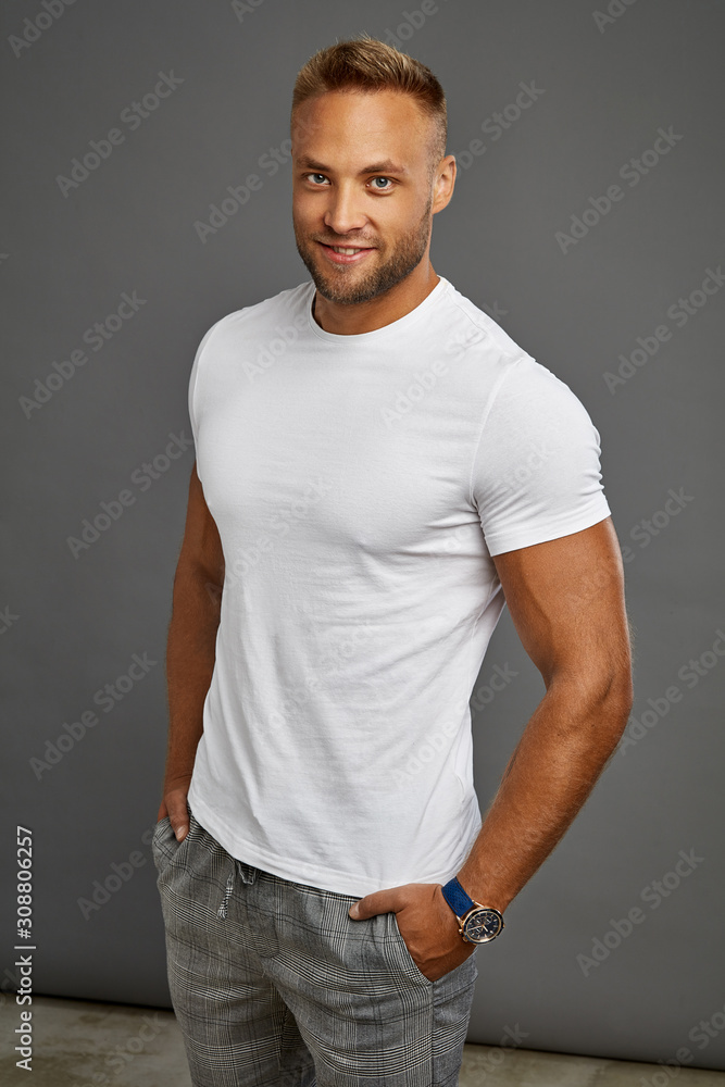 Handsome man in daily outfit isolated on gray background Handsome man in daily outfit isolated on gray background