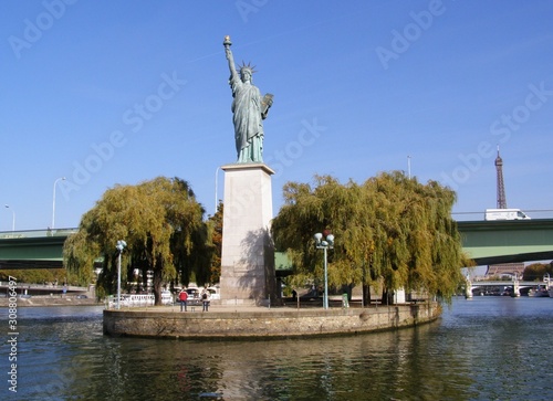 View of the Statue of Liberty in Paris from a pleasure boat on the Seine River.