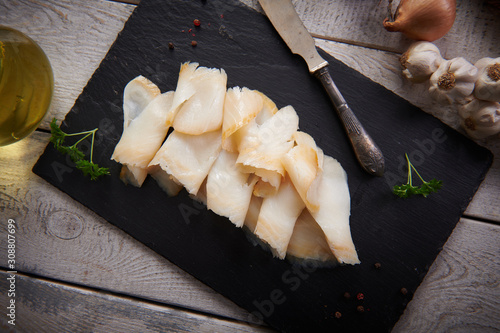 Fototapeta Delicious smoked halibut slices close up